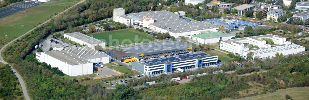 Aerial photograph Ottobrunn - Industrial estate and company settlement Gewerbegebiet Nord in Ottobrunn in the state of Bavaria. The settlement includes several office buildings and logistics centre as well as site of Deutsche Post