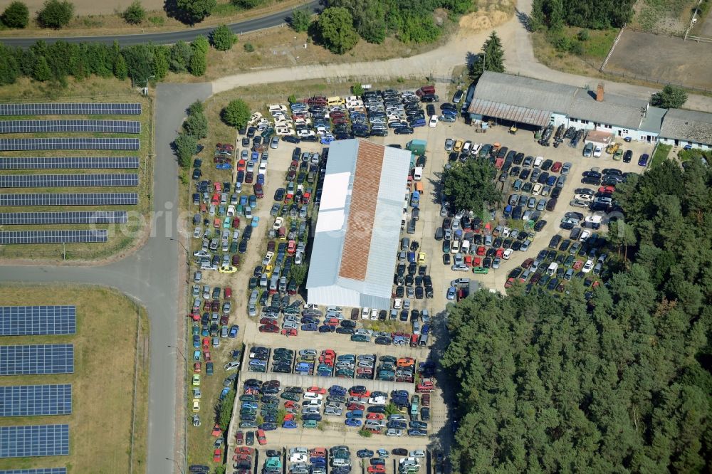 Aerial image Rietz-Neuendorf - Commercial area of the Alt-Golm part in the North of the borough of Rietz-Neuendorf in the state of Brandenburg. The area with its shopping facilities and companies is located on the edge of a forest