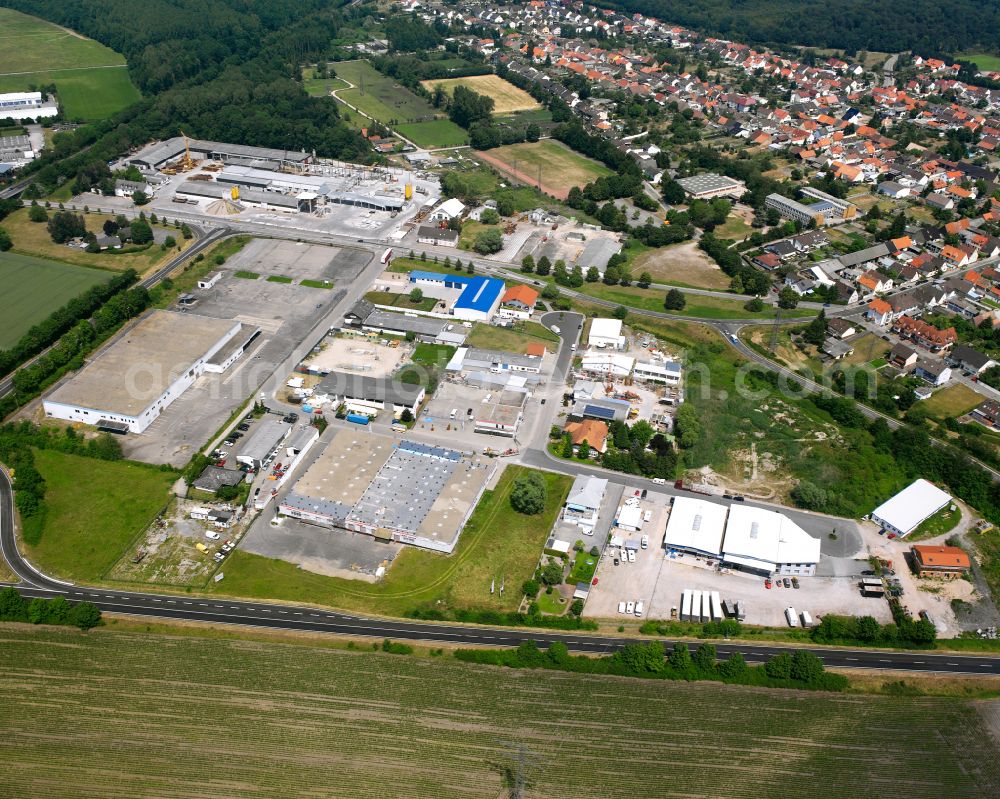 Philippsburg from the bird's eye view: Industrial estate and company settlement on street In der Kuehweid in the district Huttenheim in Philippsburg in the state Baden-Wuerttemberg, Germany