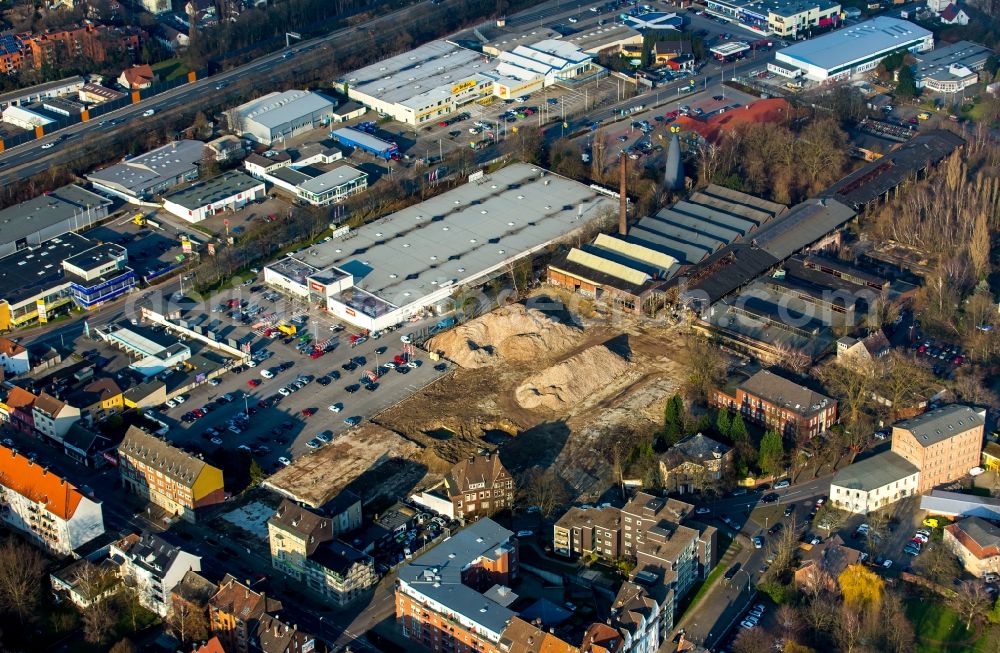 Aerial photograph Herne - Industrial estate and company settlement on Roonstrasse in Herne in the state of North Rhine-Westphalia. The area includes old factories, construction sites, a hardware store and a supermarket