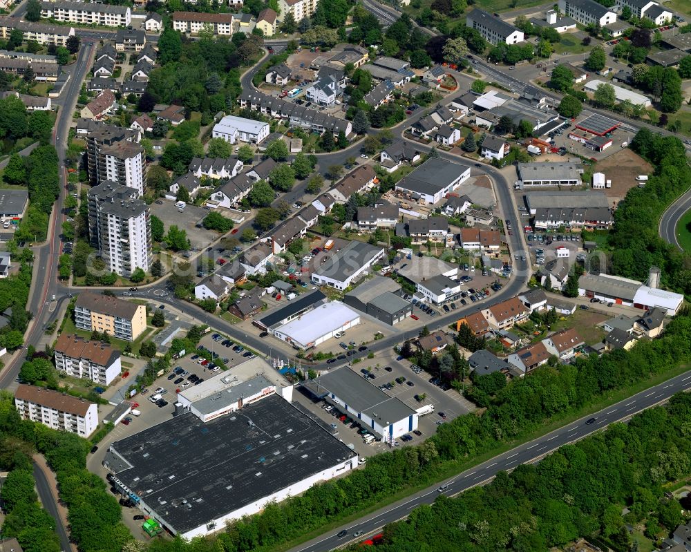 Andernach from the bird's eye view: Commercial area in the South of Andernach in the state of Rhineland-Palatinate. The town is located in the county district of Mayen-Koblenz on the left riverbank of the river Rhine. The town is characterised by industry, consists of five boroughs and districts and belongs to the oldest towns in Germany. The commercial area includes food and grocery stores, a gas station and several other shopping facilities. It is located on the federal highway B9