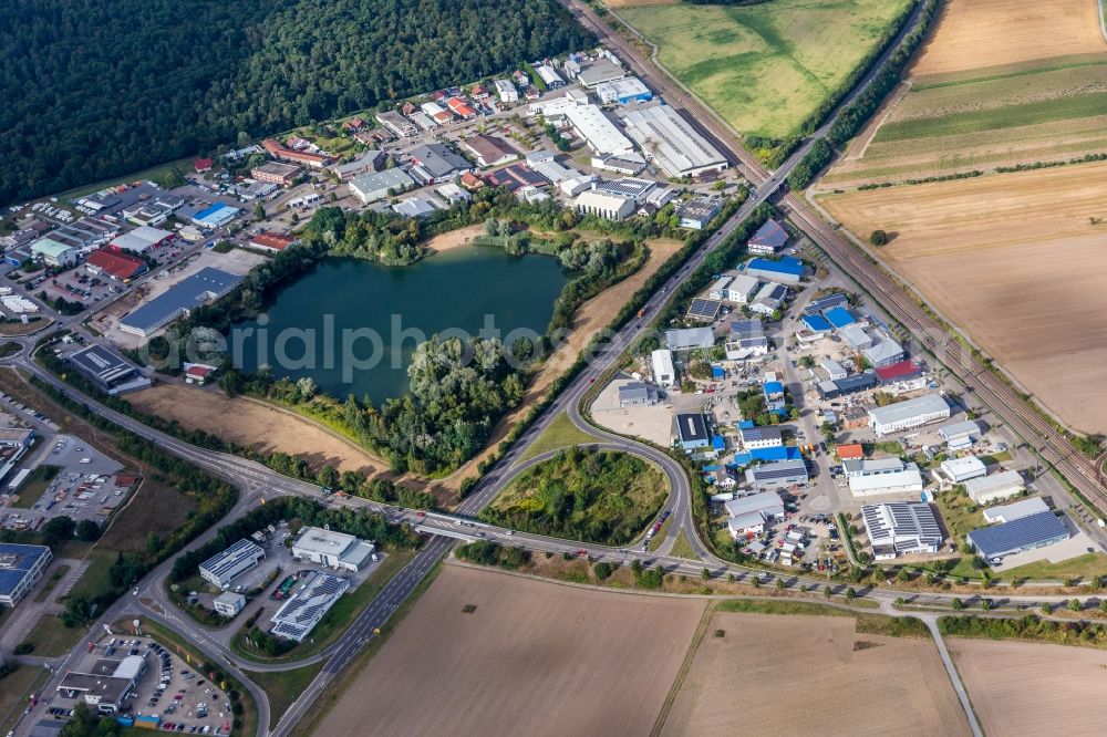 Aerial photograph Stutensee - Industrial estate and company settlement at the lake in Stutensee in the state Baden-Wurttemberg, Germany