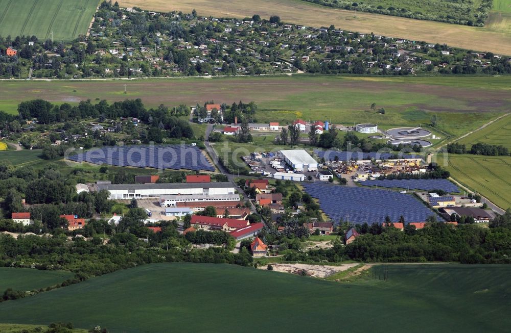 Aerial image Apolda-Heusdorf - In the commercial area on Kalkteich in Apolda Heusdorf solar systems were built on some surfaces. The photovoltaic system is the regional energy provider ENA - operated energy networks Apolda GmbH. In the background, the treatment plant of the water GmbH is seen. Google Übersetzer für Unternehmen:Translator ToolkitWebsite-ÜbersetzerGlobal Market Finder Sofortübersetzung deaktivierenÜber Google ÜbersetzerMobilDatenschutzHilfeFeedback geben