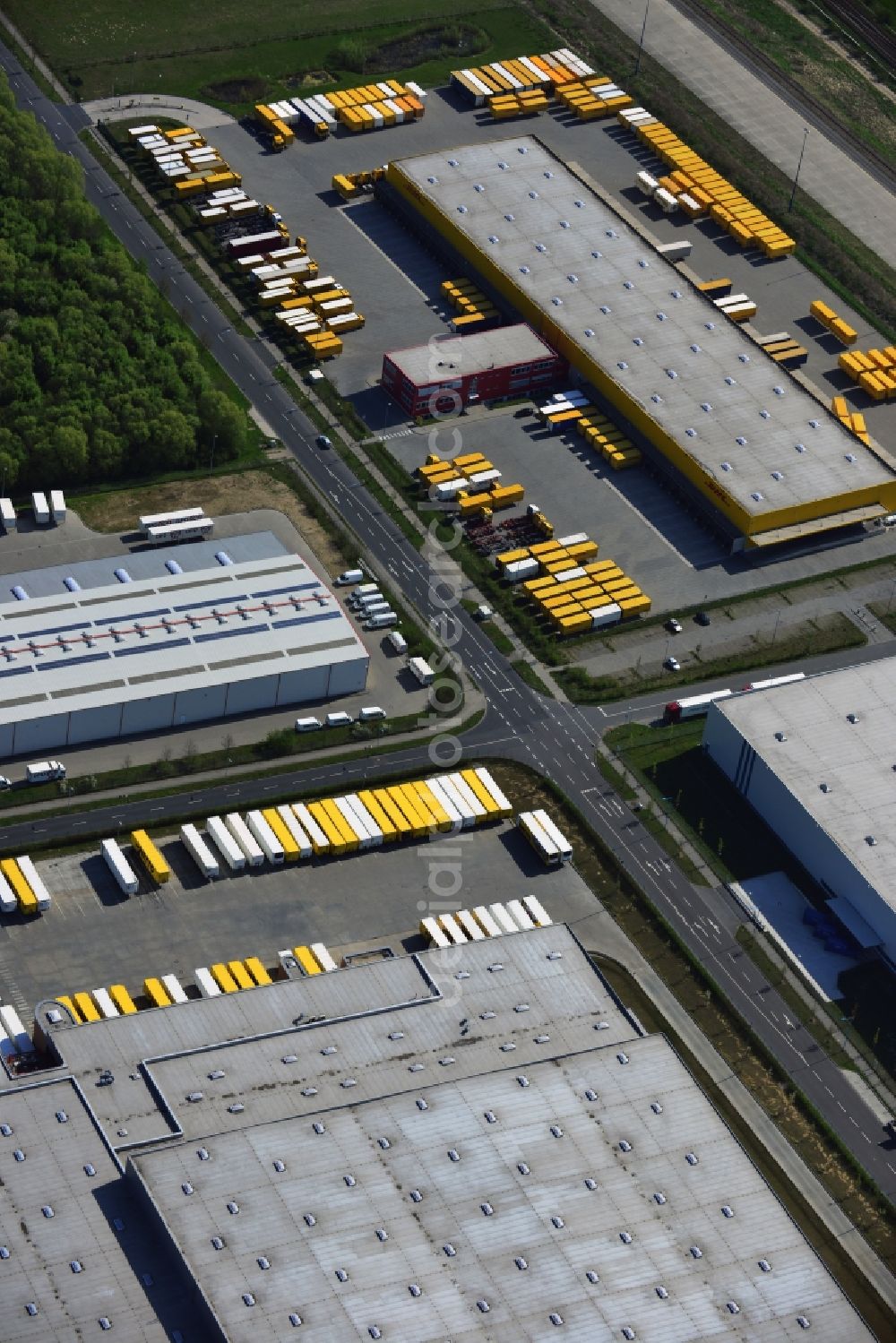 Wustermark from the bird's eye view: Commercial area with the freight forwarding and logistics center DHL hub distribution center Wustermark in the state of Brandenburg