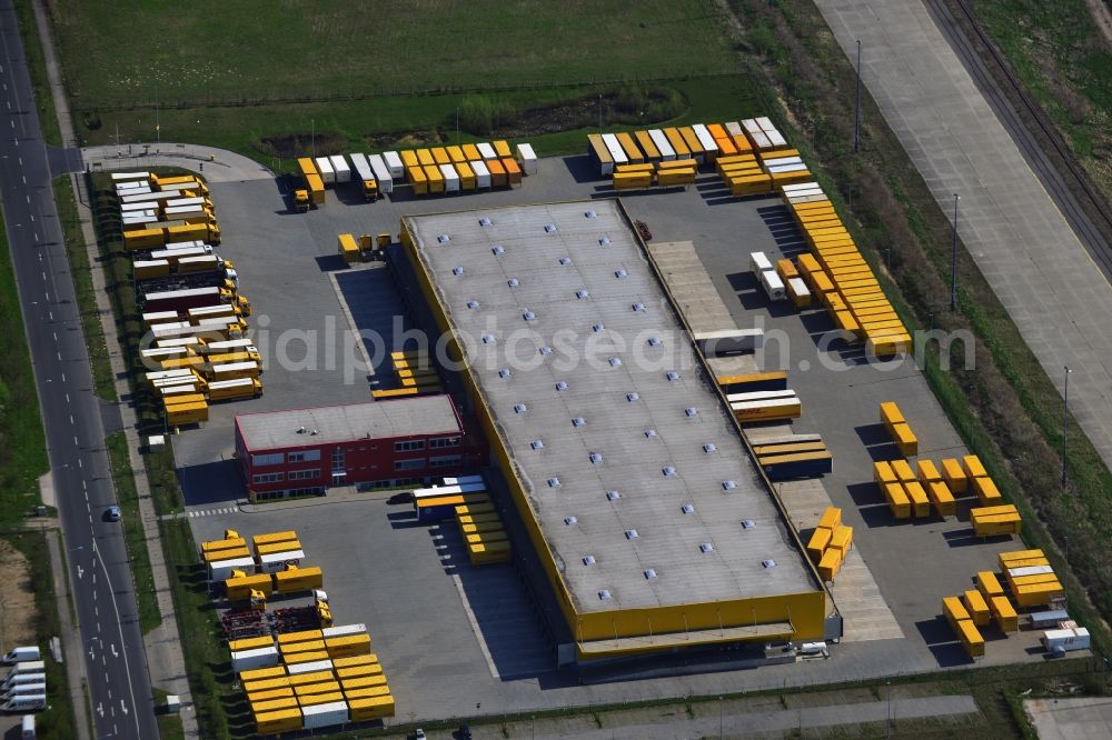 Wustermark from the bird's eye view: Commercial area with the freight forwarding and logistics center DHL hub distribution center Wustermark in the state of Brandenburg