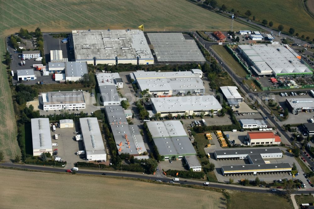 Lindenberg from the bird's eye view: Industrial estate and company settlement an der Strasse Bucher Weg in Lindenberg in the state Brandenburg