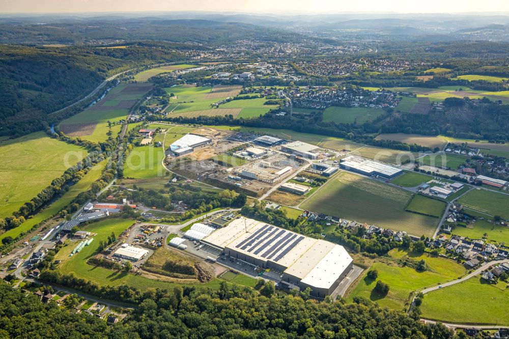 Aerial photograph Arnsberg - Industrial estate and company settlement on Vosswinkler Strasse with Blick auf das Unternehmens-Verwaltungsgebaeude and Logistikzentrum of TRIO Leuchten GmbH on street Gut Nierhof - Specksloh in the district Vosswinkel in Arnsberg at Sauerland in the state North Rhine-Westphalia, Germany