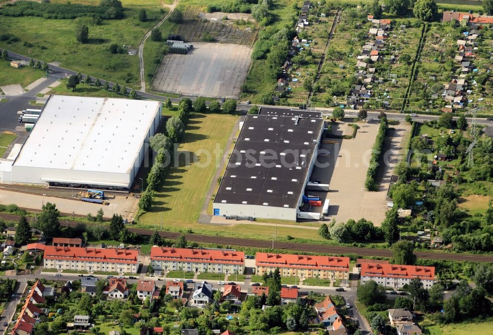 Aerial photograph Eisenach - Two service companies in the automotive industry in the Adam-Opel-road in Eisenach in Thuringia their establishment. The left of the two halls used by logistics companies Schnellecke Module GmbH warehousing and order picking. In the next stationary operation of the Lear Seating GmbH & Co.KG accessories are made ??for the car production