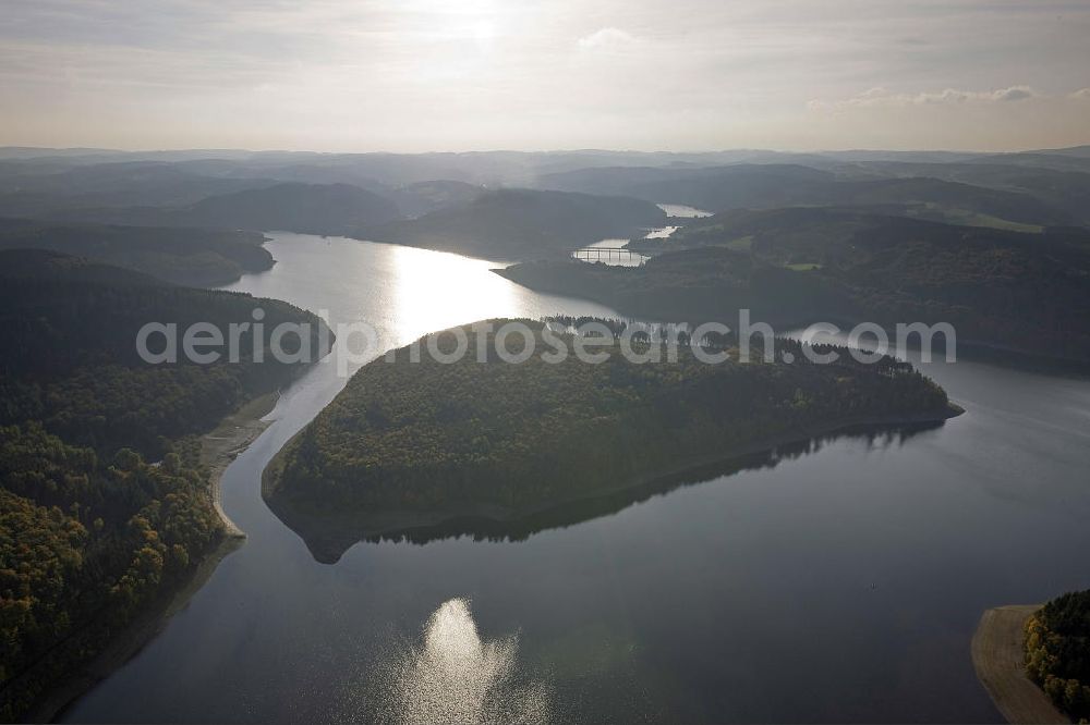 Aerial photograph Attendorn - Blick auf die Gilberg-Insel im Biggesee, einem knapp 9 Quadratkilometer großen Stausee in Nordrhein-Westfalen. Die unbewohnte Insel entstand nach der Flutung des Biggesees und bildet mit der mit der benachbarten Uferregion ein Naturschutzgebiet. View of Gilberg Island in the lake Biggesee, an almost 9 square-kilometer storage lake in North Rhine-Westphalia. The uninhabited island was created by the flooding of the Biggesee and forms with the adjacent shore region a protected area.