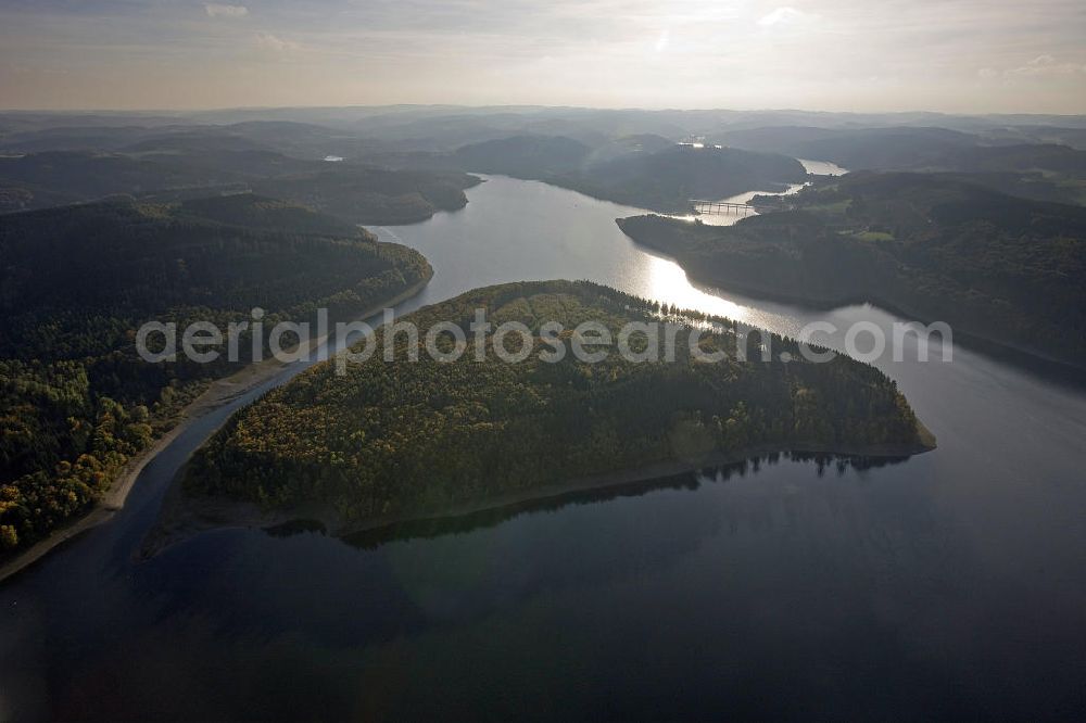 Attendorn from above - Blick auf die Gilberg-Insel im Biggesee, einem knapp 9 Quadratkilometer großen Stausee in Nordrhein-Westfalen. Die unbewohnte Insel entstand nach der Flutung des Biggesees und bildet mit der mit der benachbarten Uferregion ein Naturschutzgebiet. View of Gilberg Island in the lake Biggesee, an almost 9 square-kilometer storage lake in North Rhine-Westphalia. The uninhabited island was created by the flooding of the Biggesee and forms with the adjacent shore region a protected area.