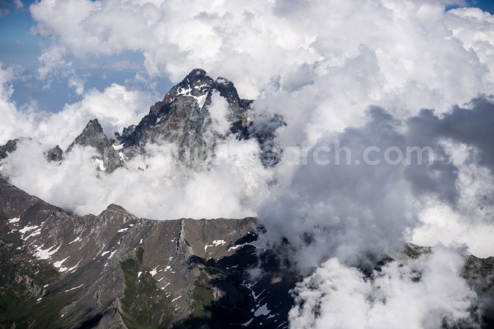 Oncino from the bird's eye view: Cloud covered peak of Monte Viso in the rock and mountain landscape in Oncino in Piedmont, Italy