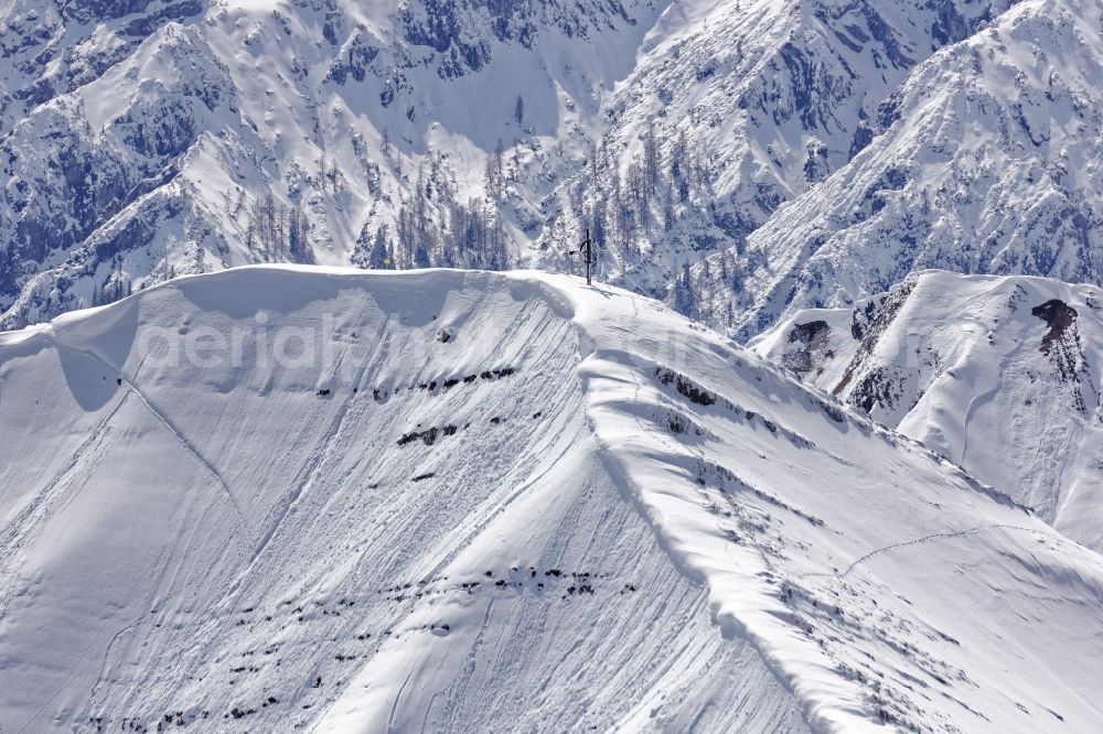 Aerial photograph Achenkirch - Summit cross on the wintry mountainous landscape Seekarspitze near Achenkirch am Achensee in the state of Tyrol, Austria. The Seekarspitze lies on the eastern edge of the Karwendel