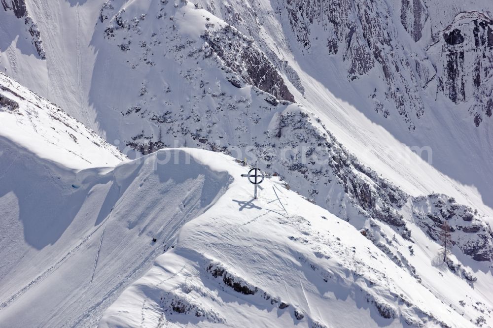 Aerial photograph Achenkirch - Summit cross on the wintry mountainous landscape Seekarspitze near Achenkirch am Achensee in the state of Tyrol, Austria. The Seekarspitze lies on the eastern edge of the Karwendel