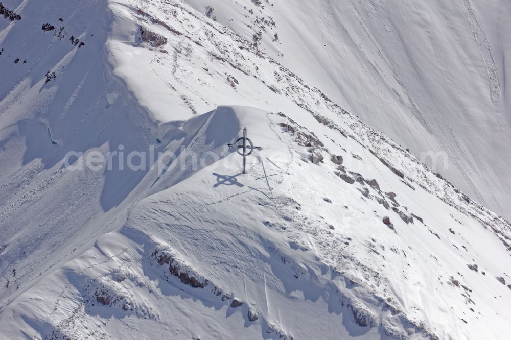 Achenkirch from above - Summit cross on the wintry mountainous landscape Seekarspitze near Achenkirch am Achensee in the state of Tyrol, Austria. The Seekarspitze lies on the eastern edge of the Karwendel