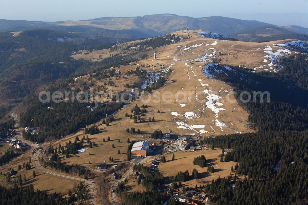 Aerial image Feldberg (Schwarzwald) - Almost without snow is the summit region of the highest mountain in the Black Forest, the Feldberg in Feldberg (Schwarzwald) in Baden-Wuerttemberg. In time for the winter season and the Christmas holidays the car park has been finished on the Seebuck and the new ski lift is ready to work. But there is no snow for winter sports.