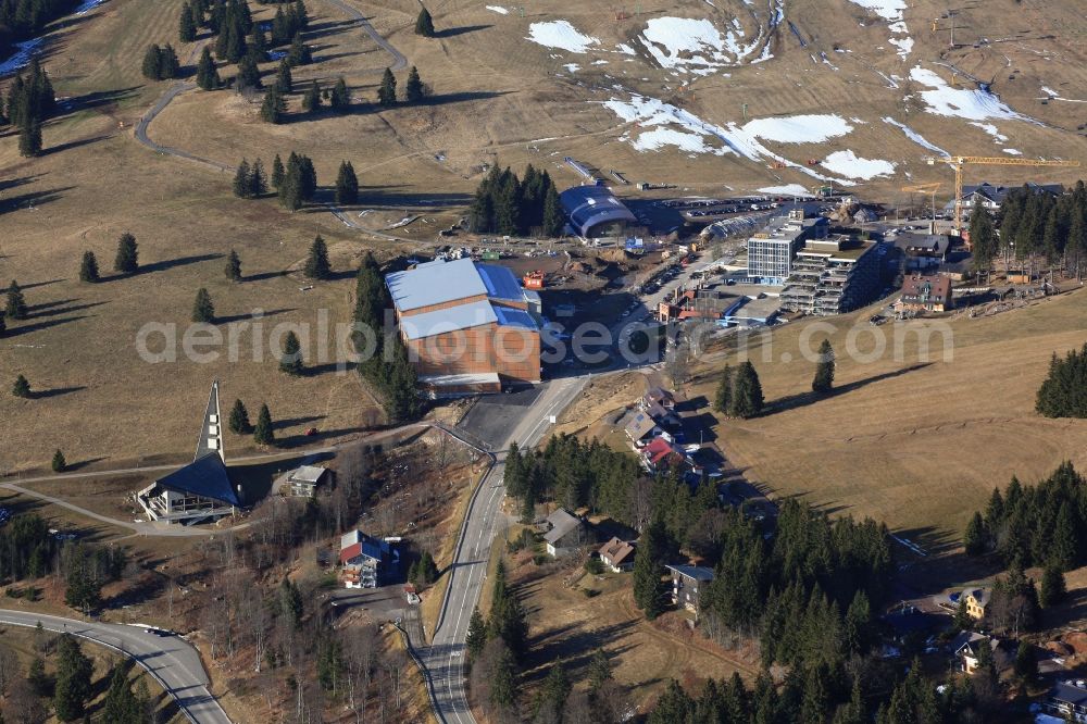 Feldberg (Schwarzwald) from the bird's eye view: Almost without snow is the summit region of the highest mountain in the Black Forest, the Feldberg in Feldberg (Schwarzwald) in Baden-Wuerttemberg. In time for the winter season and the Christmas holidays the car park has been finished on the Seebuck. But there is no snow for winter sports