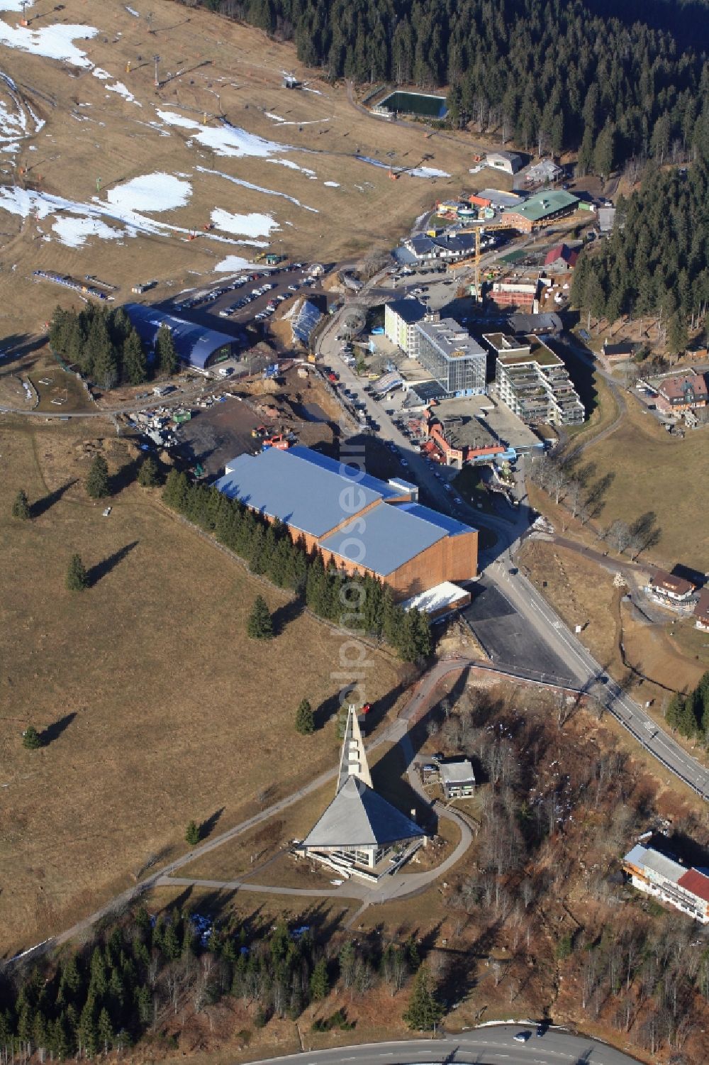 Feldberg (Schwarzwald) from the bird's eye view: Almost without snow is the summit region of the highest mountain in the Black Forest, the Feldberg in Feldberg (Schwarzwald) in Baden-Wuerttemberg. In time for the winter season and the Christmas holidays the car park has been finished on the Seebuck. But there is no snow for winter sports