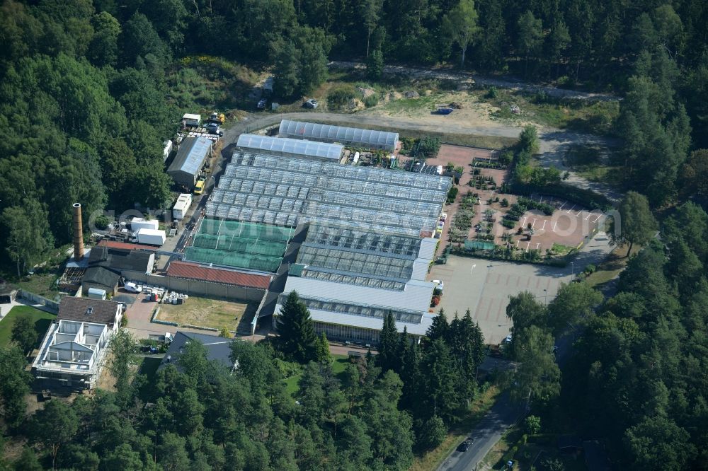 Aerial photograph Petershagen - Glass houses and gardening store of Gaertnerei Rudolf and Gerd Kolbinger GbR in Petershagen in the state of Brandenburg. The garden-center with its parking lot and different green houses is located on L33, the Altlandsberger Chaussee