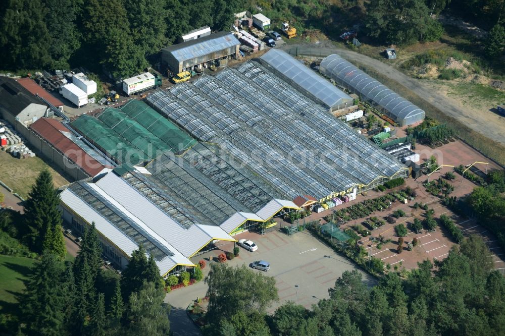 Aerial image Petershagen - Glass houses and gardening store of Gaertnerei Rudolf and Gerd Kolbinger GbR in Petershagen in the state of Brandenburg. The garden-center with its parking lot and different green houses is located on L33, the Altlandsberger Chaussee