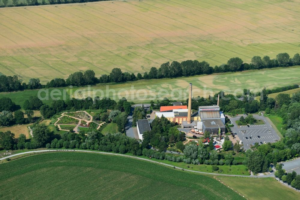 Derenburg from the bird's eye view: Building and production halls on the premises of Glasmanufaktur Harzkristall GmbH Im Freien Felde in Derenburg in the state Saxony-Anhalt, Germany