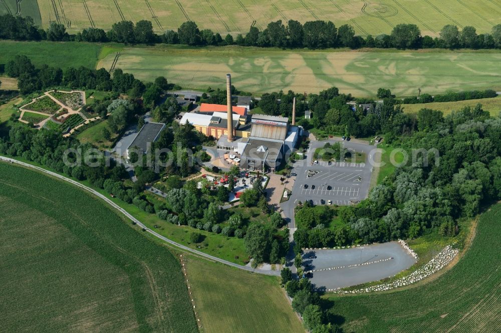 Aerial photograph Derenburg - Building and production halls on the premises of Glasmanufaktur Harzkristall GmbH Im Freien Felde in Derenburg in the state Saxony-Anhalt, Germany