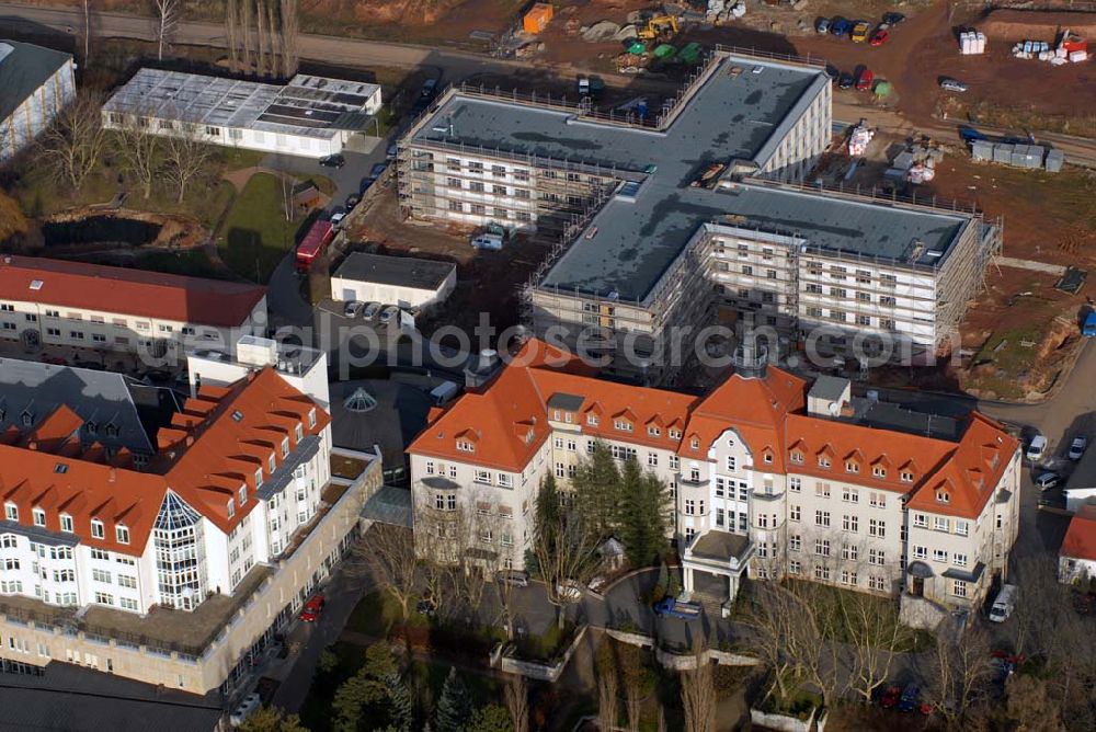 Aerial photograph Glauchau - Blick auf die Erweiterungsbaustelle des Kreiskrankenhaus Rudolf Virchow. Der Rohbau wurde von der Firma Riedel Bau ausgeführt. Kontakt: Firmengruppe Riedel Bau, Silbersteinstraße 4, 97424 Schweinfurt, Tel. 09721 676-0, Fax 09721 676-110, E-Mail info@riedelbau.de,