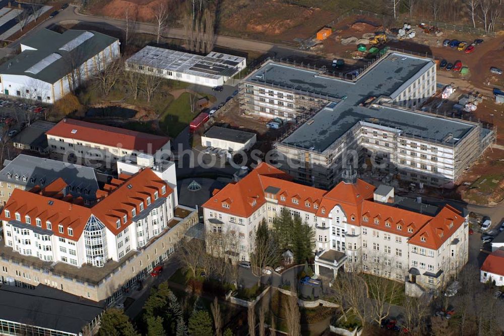 Aerial photograph Glauchau - Blick auf das Gelände des Kreiskrankenhaus Rudolf Virchow mit der Baustelle des Erweiterungsbau. Kontakt: Kreiskrankenhaus Rudolf Virchow gGmbH Glauchau, Virchowstraße 18, 08371 Glauchau, Tel. 03763 43-0, E-Mail info@kreiskrankenhaus-glauchau.de,