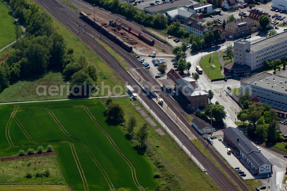 Bad Neustadt an der Saale from the bird's eye view: Station railway building of the Deutsche Bahn in Bad Neustadt an der Saale in the state Bavaria, Germany