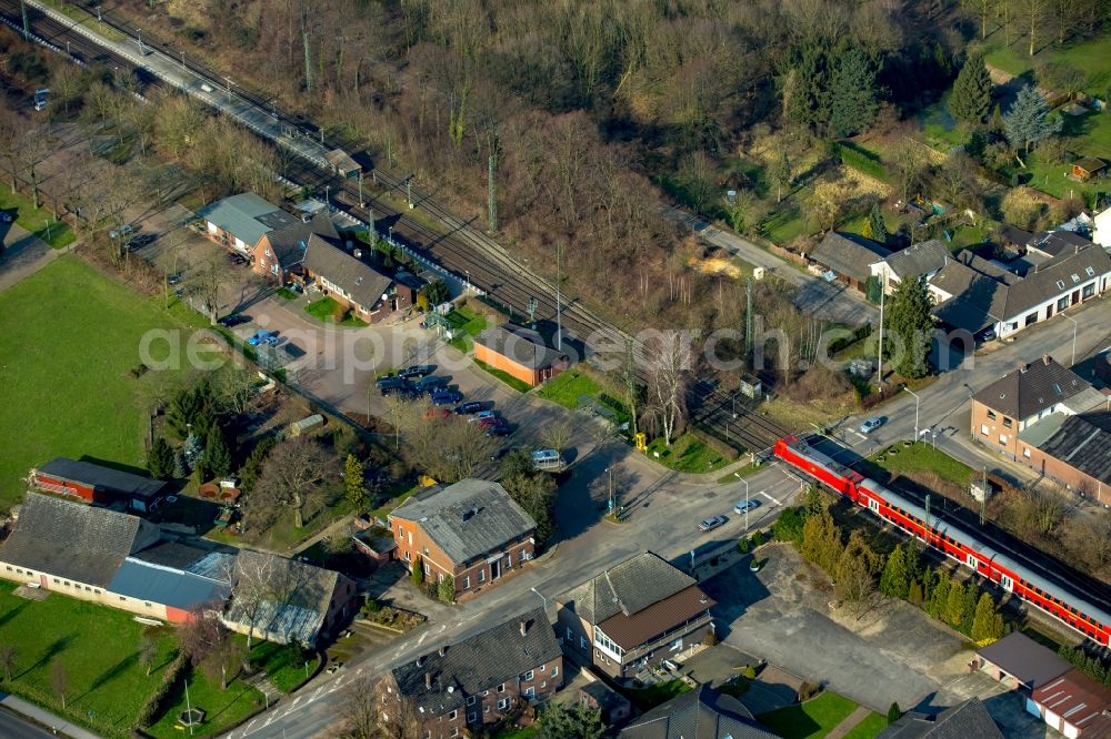 Rees from above - Track history and railway station of the Deutsche Bahn Empel-Rees with red regional train in Rees in North Rhine-Westphalia