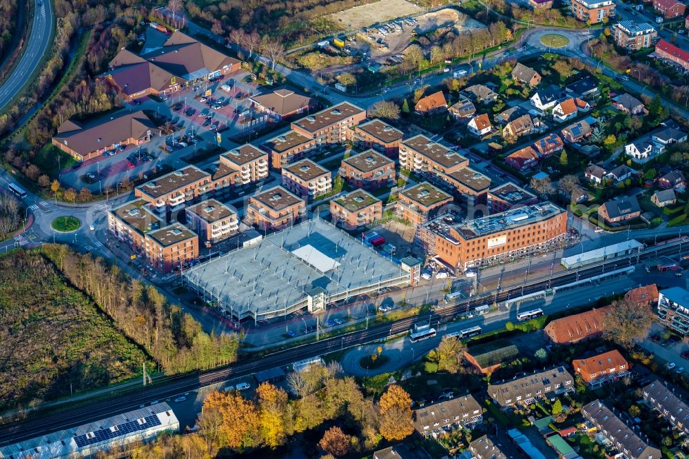 Neu Wulmstorf from the bird's eye view: Track layout and station building and new development area in Neu Wulmstorf in the state Lower Saxony, Germany