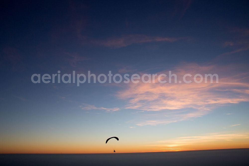 Aerial photograph Michelstadt - Paraglider at sunset at the horizon over Vielbrunn in Michelstadt in the state Hesse