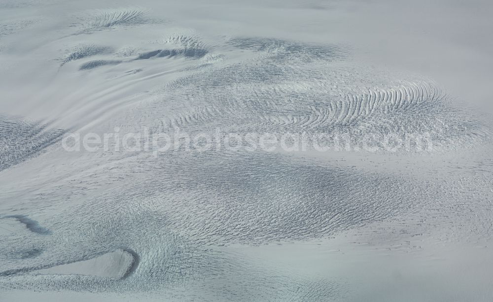 Greenland from the bird's eye view: White, snowy ice glacial landscape Greenland in in Kommuneqarfik Sermersooq, Greenland