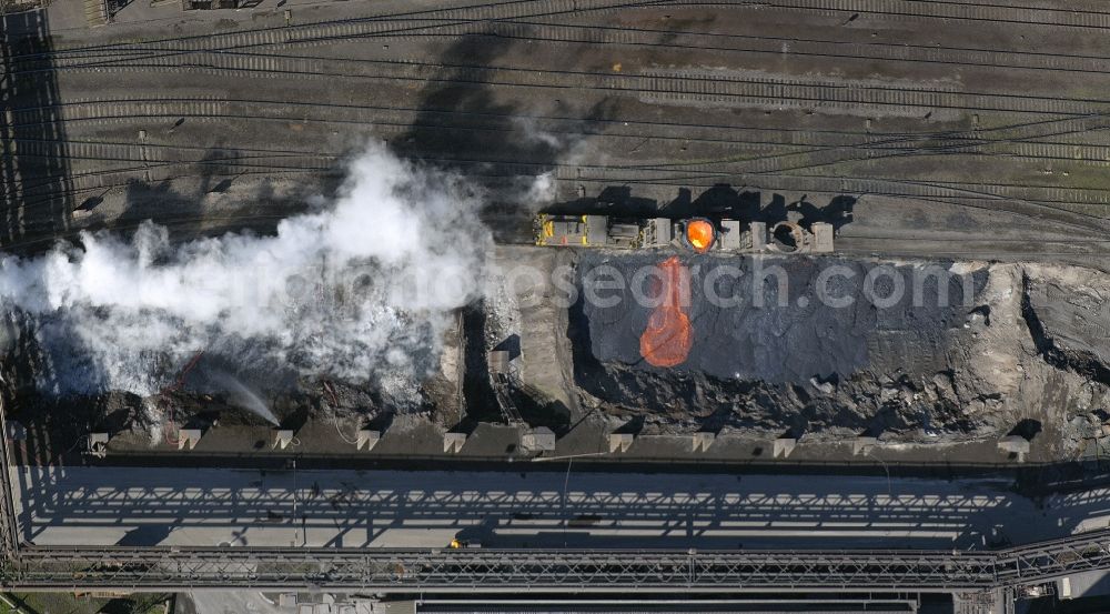 Aerial photograph Duisburg - Glowing steel slag melt in the ThyssenKrupp steel plant in Duisburg in North Rhine-Westphalia