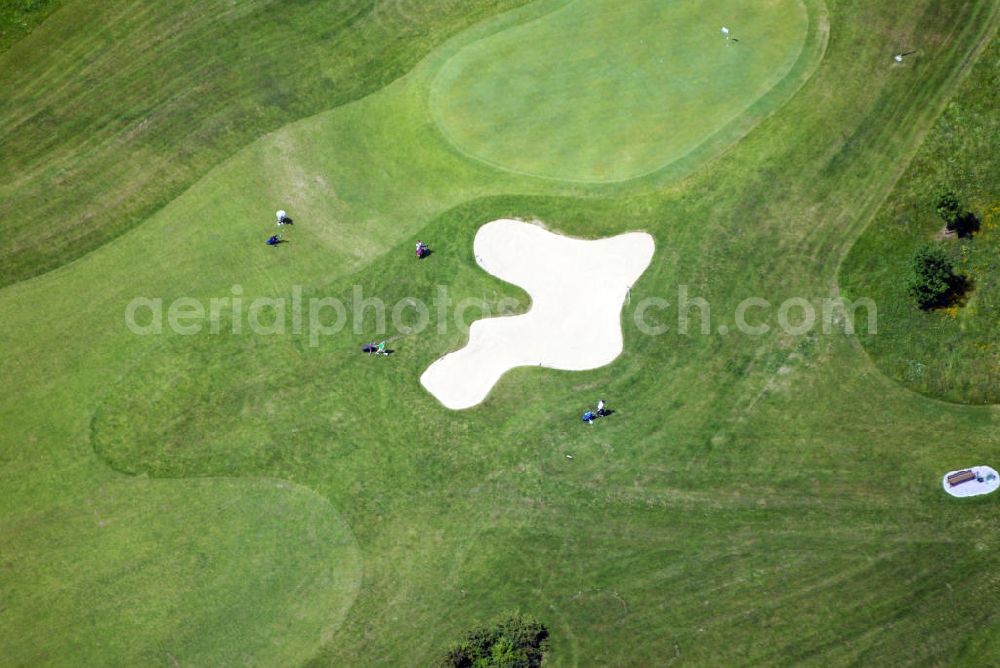 Aerial photograph Münnerstadt - Blick auf die Golfanlage des Golf Clubs Maria Bildhausen. Die Golfanlage ist die einzige im Besitz eines Klosters. Auf den 138 ha ehemals landwirtschaftlich genutzten Arealen des Klosters wurde 1992 ein Golfplatz gebaut. Betreiber ist der Golfclub Maria Bildhausen e.V. Auf dem 18-Loch-Platz wurden Teile der natürlichen Feld- und Wiesenlandschaft erhalten und als Parkland-Golfplatz angelegt. Kontakt: GC Maria Bildhausen e.V, Rindhof 1, 97702 Münnerstadt, Tel: 09766 / 1601.