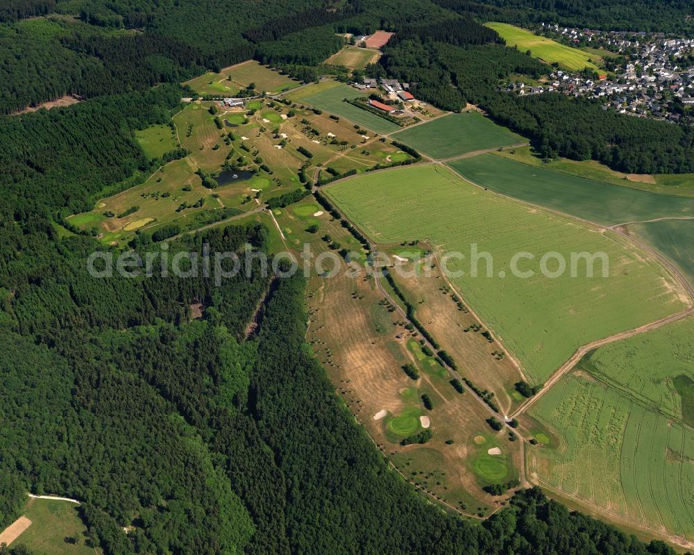 Kirschweiler from above - Golf course of the Golf Club Edelstein-Hunsrueck in the state of Rhineland-Palatinate. The borough and municipiality is an official tourist resort and located in the county district of Birkenfeld, in the Hunsrueck region. The golf course is located on the edge of a forest in the West of the village