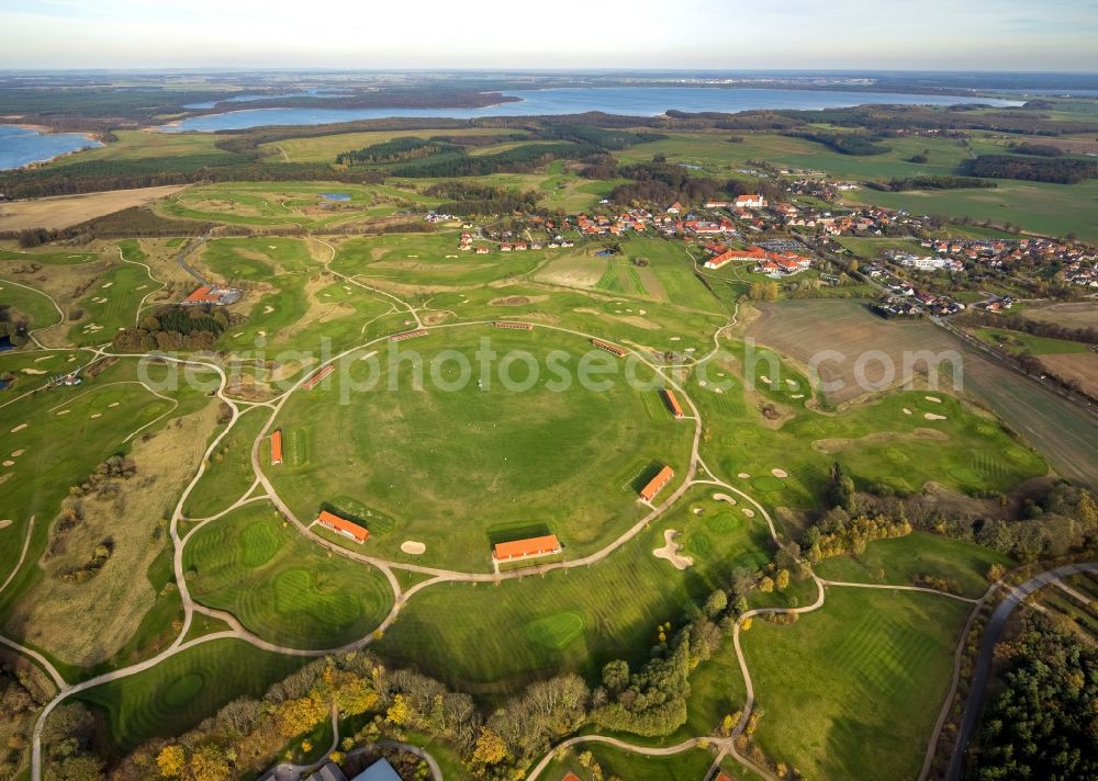 Göhren-Lebbin from above - The golfing facilities and the golf club in the borough of Göhren-Lebbin on lake Fleesensee in the state of Mecklenburg-Vorpommern. The borough is a renowned climatic spa with a local golf club consisting of 5 different courses and over 70 holes. There is also a round golf arena for training. The landscape is informed by the region of the Mecklenburg lake district
