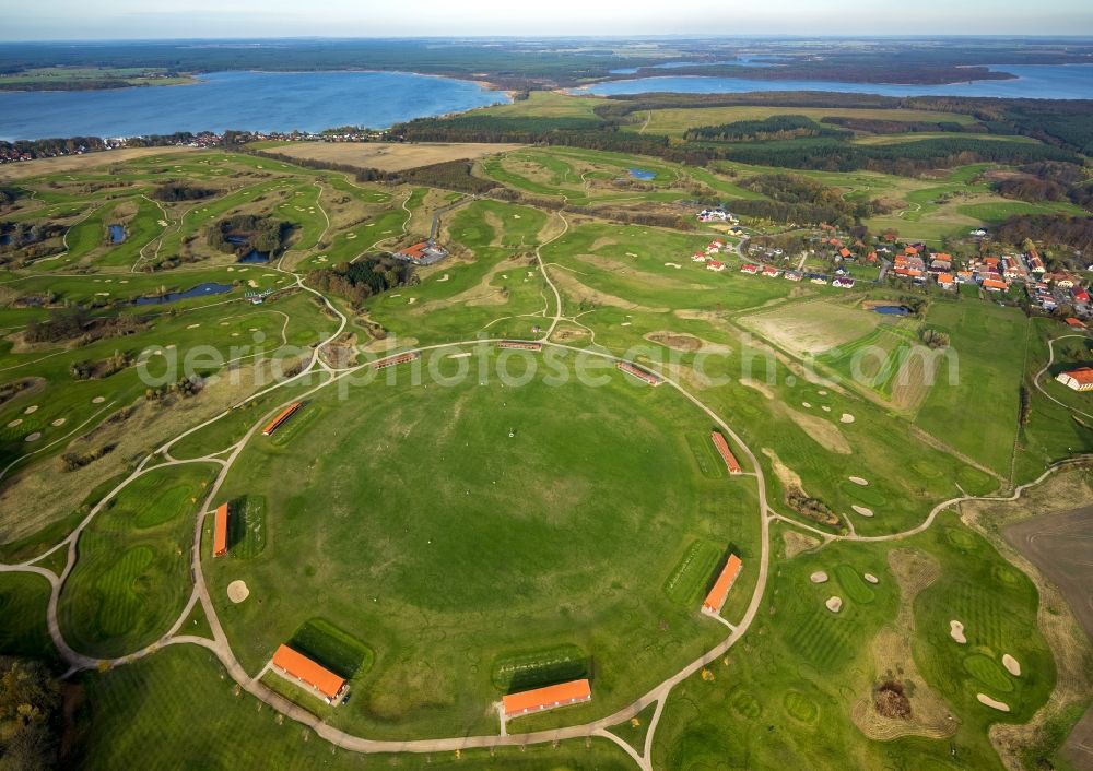 Aerial photograph Göhren-Lebbin - The golfing facilities and the golf club in the borough of Göhren-Lebbin on lake Fleesensee in the state of Mecklenburg-Vorpommern. The borough is a renowned climatic spa with a local golf club consisting of 5 different courses and over 70 holes. There is also a round golf arena for training. The landscape is informed by the region of the Mecklenburg lake district