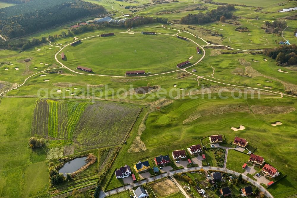 Göhren-Lebbin from above - The golfing facilities and the golf club in the borough of Göhren-Lebbin on lake Fleesensee in the state of Mecklenburg-Vorpommern. The borough is a renowned climatic spa with a local golf club consisting of 5 different courses and over 70 holes. There is also a round golf arena for training. The landscape is informed by the region of the Mecklenburg lake district