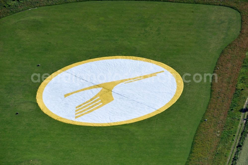 Groß Kienitz from the bird's eye view: View the golf course Great Kienitz southeast of the airport BER Construction. Pictured are on the occasion of the Lufthansa Airlines media Cup placed logos