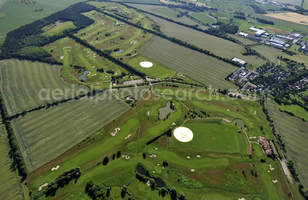 Groß Kienitz from the bird's eye view: View the golf course Great Kienitz southeast of the airport BER Construction. Pictured are on the occasion of the Lufthansa Airlines media Cup placed logos