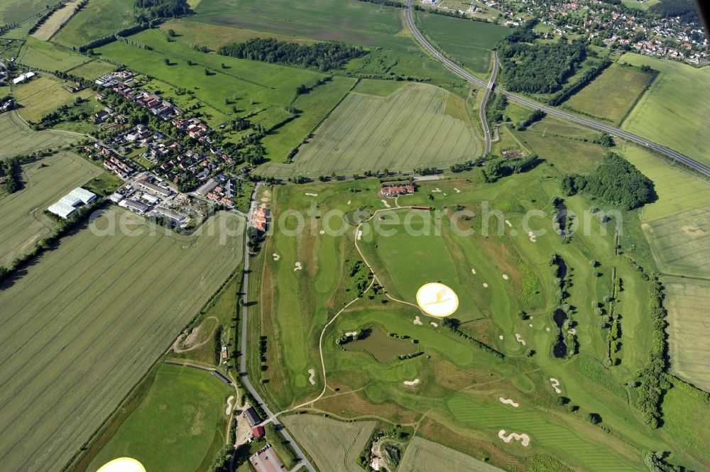 Groß Kienitz from the bird's eye view: View the golf course Great Kienitz southeast of the airport BER Construction. Pictured are on the occasion of the Lufthansa Airlines media Cup placed logos