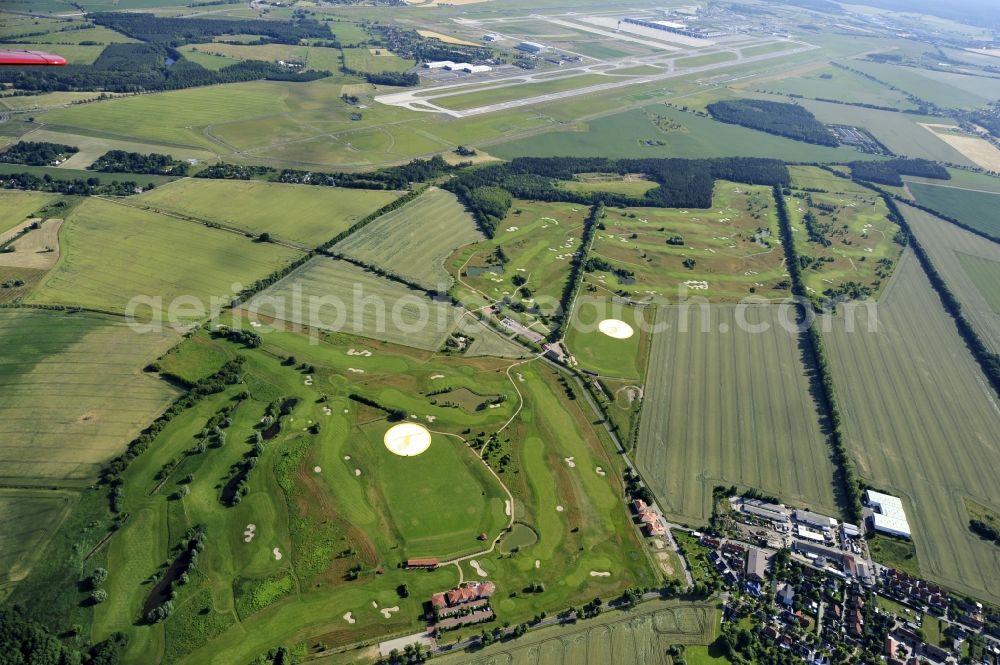 Groß Kienitz from the bird's eye view: View the golf course Great Kienitz southeast of the airport BER Construction. Pictured are on the occasion of the Lufthansa Airlines media Cup placed logos