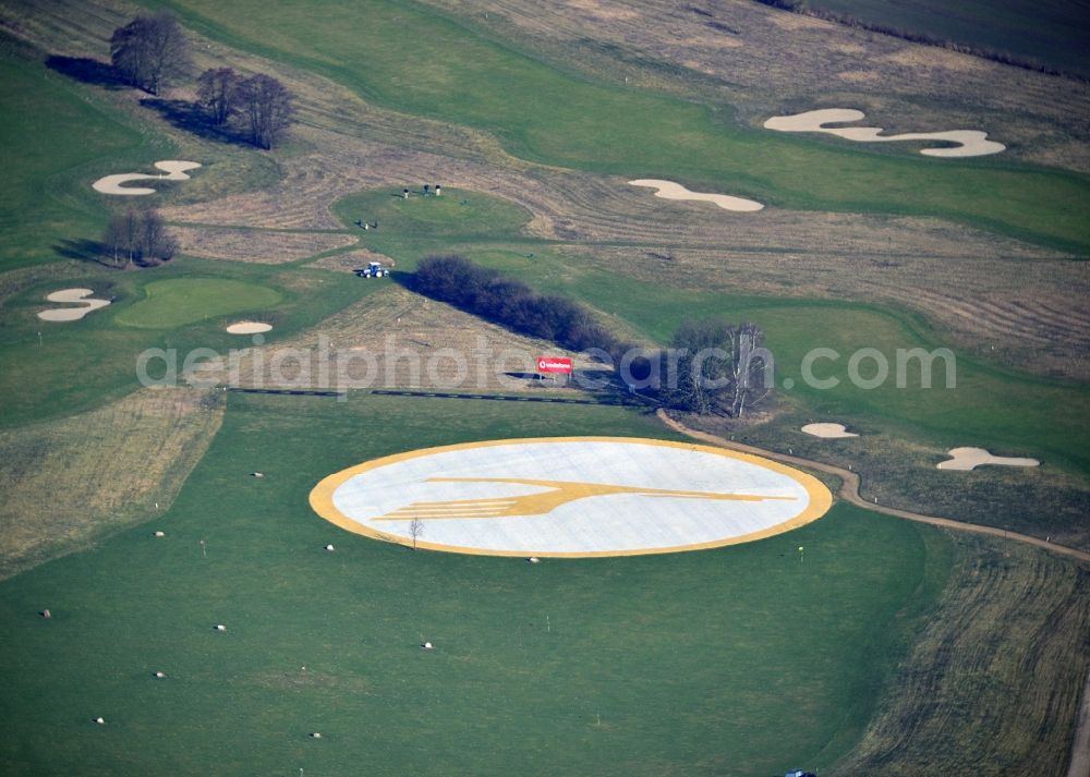 Groß Kienitz from the bird's eye view: View the golf course Great Kienitz southeast of the airport BER Construction. Pictured are on the occasion of the Lufthansa Airlines media Cup placed logos