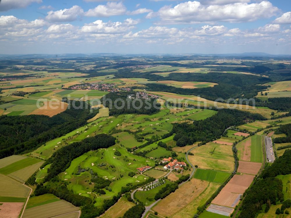 Aerial photograph Maßweiler - Golf course and landscape in Massweiler in the state of Rhineland-Palatinate. The First Golf Club Westpfalz Schwarzbachtal is surrounded by agricultural fields and wooded areas of the Sickinger heights region. The 18 hole compound includes training facilities and a restaurant