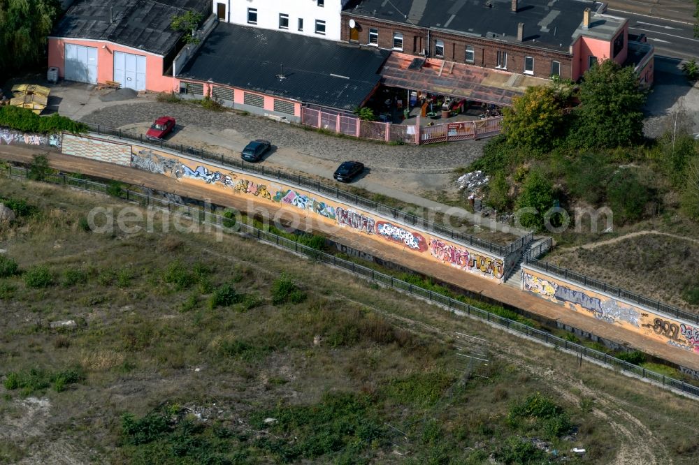 Aerial image Leipzig - Graffiti- artwork and large-area painting on the river course of the Parthe in Leipzig in the state Saxony, Germany