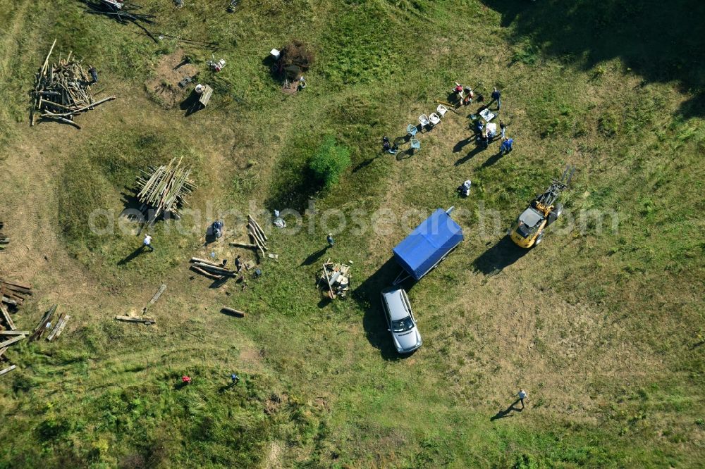 Aerial image Bernau - Structures of a field landscape with Teilnehmern eines Lagerfeuer- Treffens in Bernau in the state Brandenburg, Germany