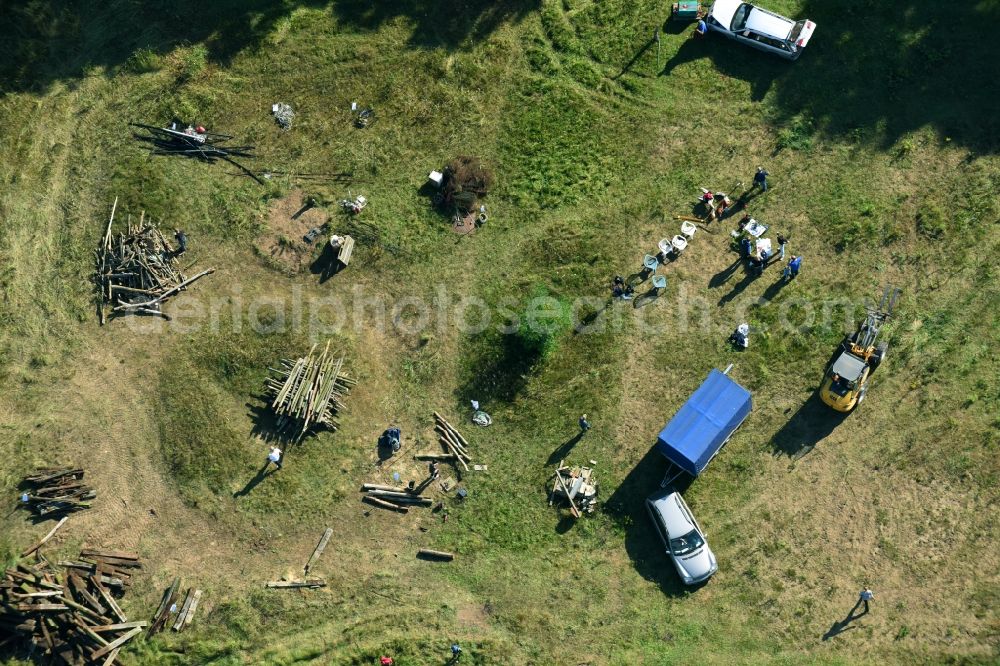 Aerial photograph Bernau - Structures of a field landscape with Teilnehmern eines Lagerfeuer- Treffens in Bernau in the state Brandenburg, Germany