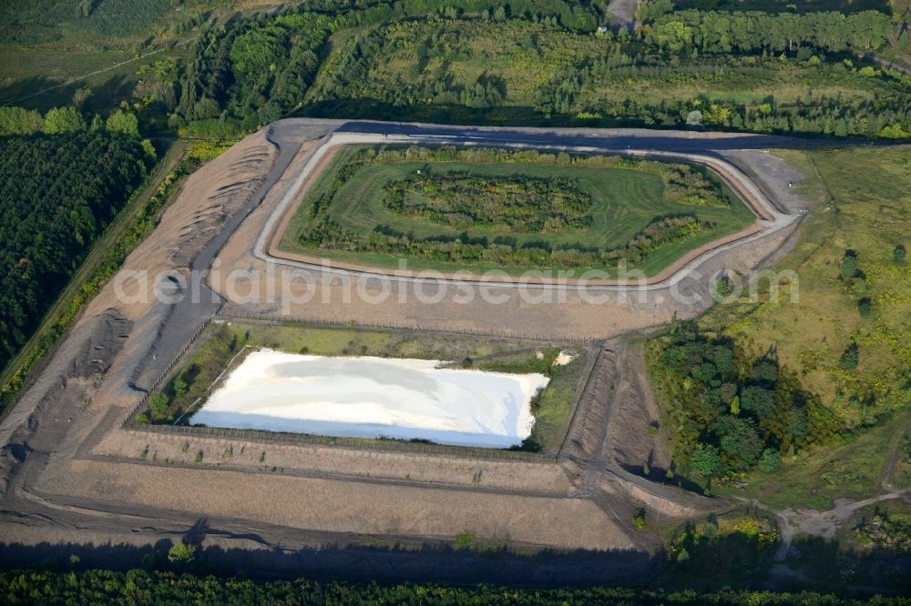 Aerial image Helbra - Gras hill and mining facilities in the South of Helbra in the state of Saxony-Anhalt. The hill and the pool with chalk and limescale are located in the South of Helbra, in its industrial area