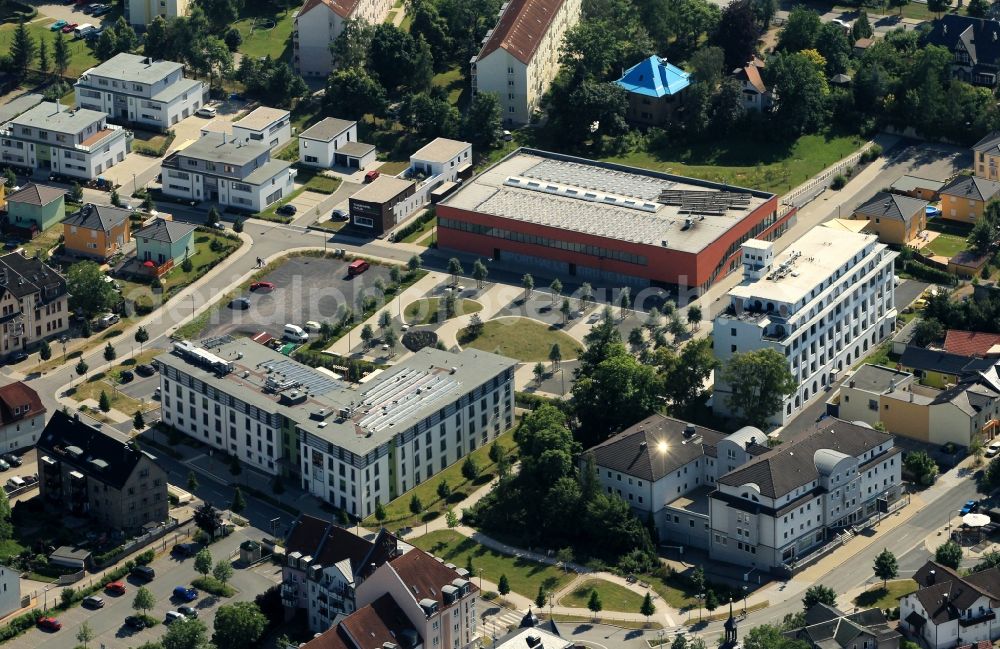 Saalfeld/Saale from above - The former packaging material plant in Saalfeld in Thuringia, the green center of the city emerged in the last few years. Here is a three-field sports hall, a medical center and a home for senior-friendly living have revived the old inner city industrial wasteland. A residence for seniors has taken over the workers' welfare