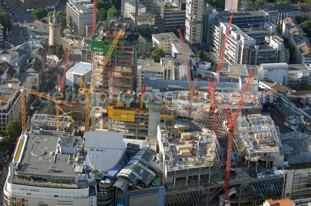 Frankfurt am Main from the bird's eye view: Großbaustelle vom Bauprojekt PalaisQuartier. Auf einer Grundstücksfläche von 17.400 qm enstehen zwei Hochhäuser ein Einkaufszentrum und ein Hotel, das nach historischem Vorbild wiedererrichtete Thurn und Taxis Palais (Schloss). Es wird eine Gesamtfläche von 226.000 qm haben und eine Tiefgarage mit 1.390 Parkplätzen. ARGE PalaisQuartier: Dreßler Bau GmbH, Müllerstraße 26, 63741 Aschaffenburg, Tel. 06021 403 0, Fax 06021 403 216, E-Mail: ab-hv@dressler-bau.de; BAM Deutschland AG, Mönchhaldenstraße 26, 70191 Stuttgart, Tel. 0711 250 07 0, Fax 0711 250 07 150, E-Mail: Info@bam-deutschland.de; Ed. Züblin AG Albstadtweg 3, 70567 Stuttgart, Tel. 0711 7883 0, Fax 0711 7883 390, E-Mail: info@zueblin.de